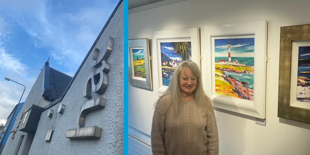 Exterior of Harbour Arts Centre and artist Pat Kramek in front of seascape paintings at new exhibition