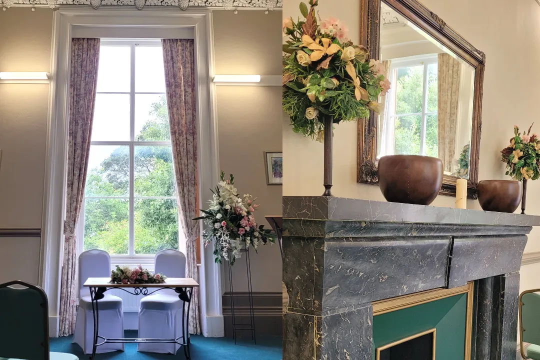 Interior of Largs ceremony room featuring marble fireplace and large picture window decorated for wedding