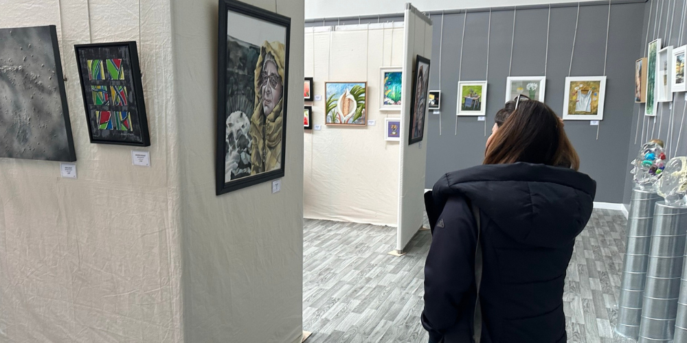 Person looking at art pieces
