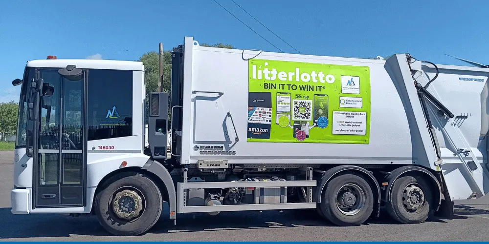 Council bin lorry with advert on side for LitterLotto app