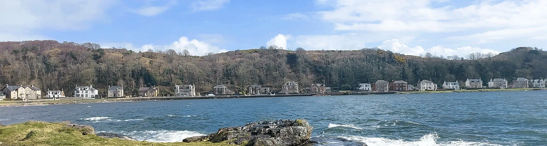 Coastal view of Millport, houses and hills 