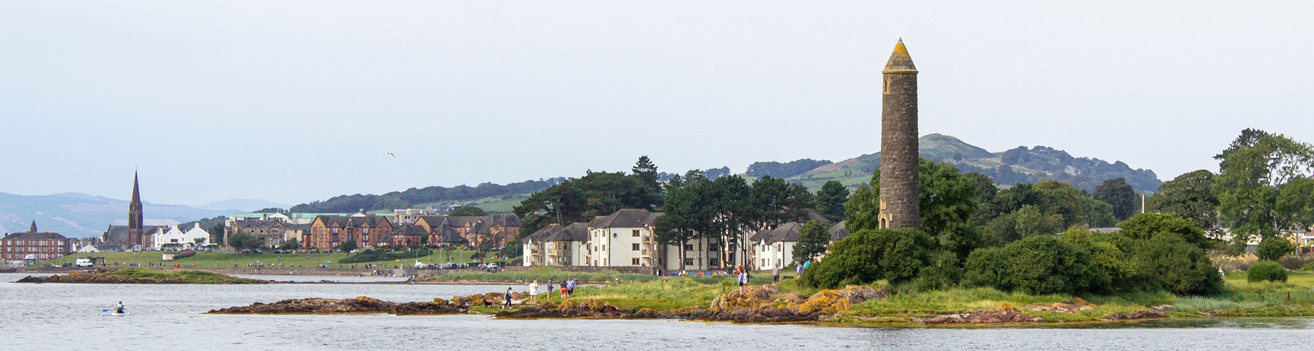 Landscape of Largs beachfront with the Pencil monument in the foreground